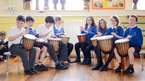 Pupils playing the drums