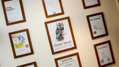 awards and accreditations hung on the wall