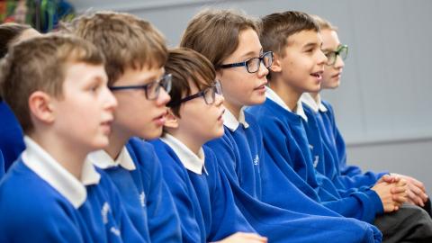 children listening during an assembly